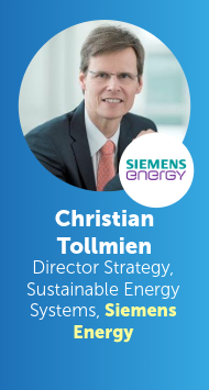 Headshot of Christian Tollmien, Director of Strategy for Sustainable Energy Systems at Siemens Energy, wearing glasses, suit and tie, with the Siemens Energy logo visible.